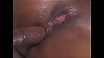 Play Lustful beauty in fishnet pantyhose masturbates pussy and takes a big black cock in a narrow gap